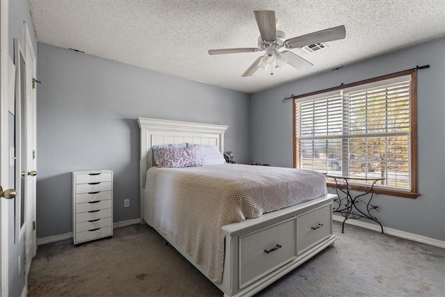 carpeted bedroom featuring visible vents, baseboards, a textured ceiling, and ceiling fan