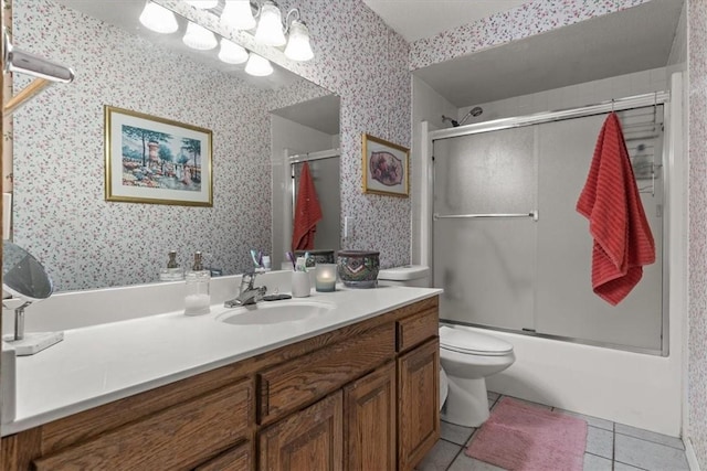 full bath with toilet, tile patterned floors, vanity, and wallpapered walls