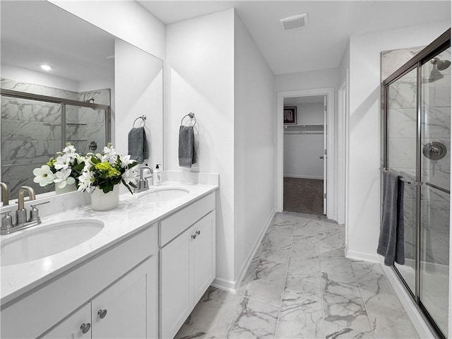 1963 Larkspur St, Springdale, AR 72762 - full bathroom with marble finish floors, double vanity, a stall shower, and a walk in closet