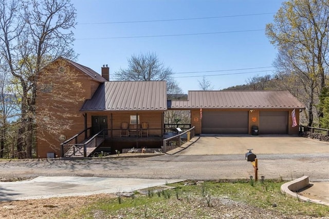 21413 Lakeview Dr, Garfield, AR 72732 - view of front of home with metal roof and a chimney