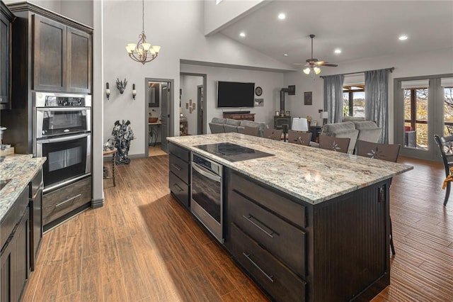 21413 Lakeview Dr, Garfield, AR 72732 - kitchen featuring double oven, dark wood-type flooring, dark brown cabinets, open floor plan, and black electric cooktop