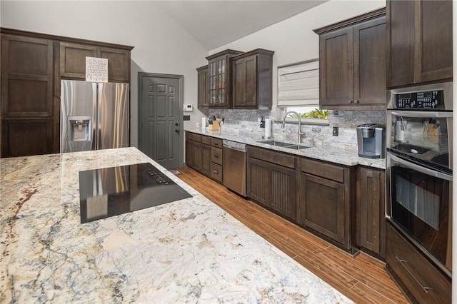 21413 Lakeview Dr, Garfield, AR 72732 - kitchen featuring a sink, wood tiled floor, light stone countertops, and stainless steel appliances