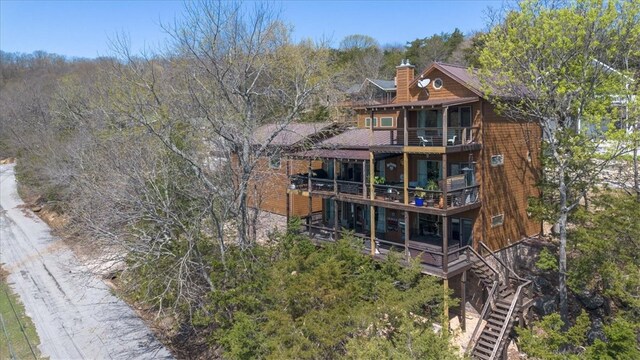 21413 Lakeview Dr, Garfield, AR 72732 - rear view of property featuring a chimney and stairway