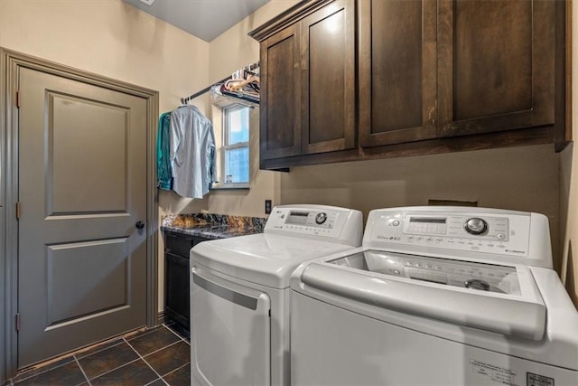 21413 Lakeview Dr, Garfield, AR 72732 - laundry area featuring cabinet space, independent washer and dryer, and dark tile patterned floors
