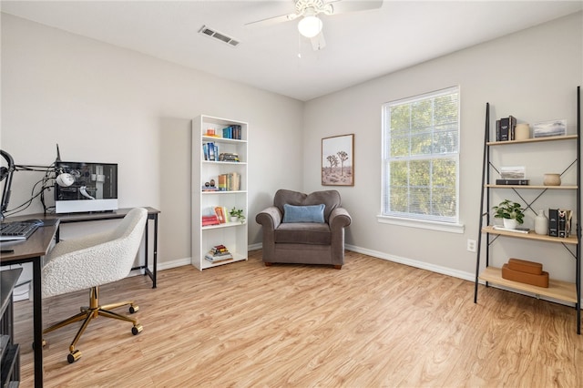 office with wood finished floors, ceiling fan, baseboards, and visible vents