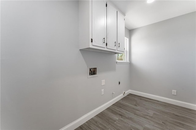 laundry area featuring hookup for a washing machine, electric dryer hookup, hookup for a gas dryer, baseboards, and cabinet space