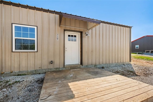 property entrance with a deck
