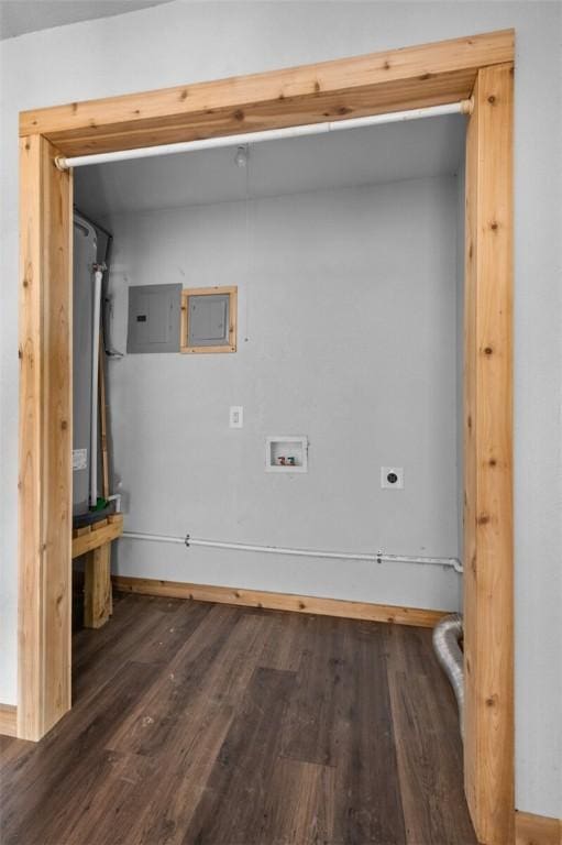 laundry room with hookup for an electric dryer, electric panel, washer hookup, laundry area, and wood finished floors