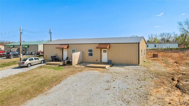 view of front of house featuring metal roof