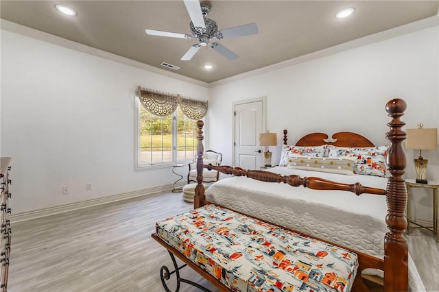 bedroom featuring crown molding, wood finished floors, visible vents, and recessed lighting