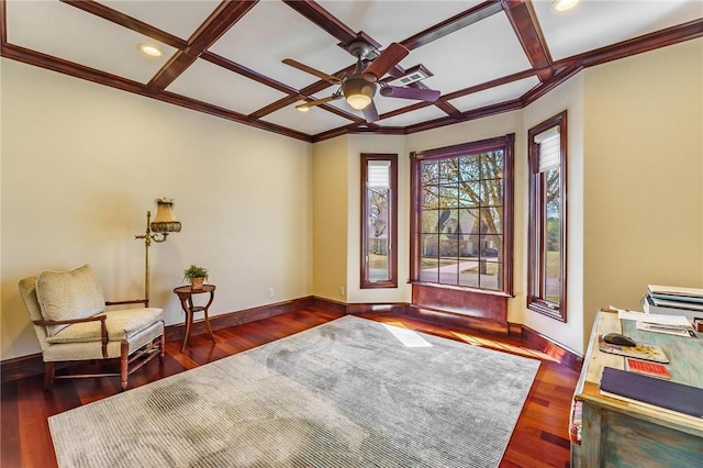unfurnished room featuring ceiling fan, ornamental molding, wood finished floors, coffered ceiling, and baseboards