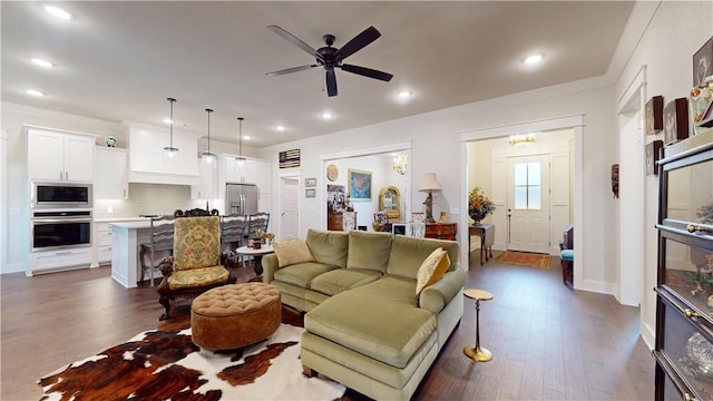 living area featuring dark wood-type flooring, recessed lighting, and a ceiling fan