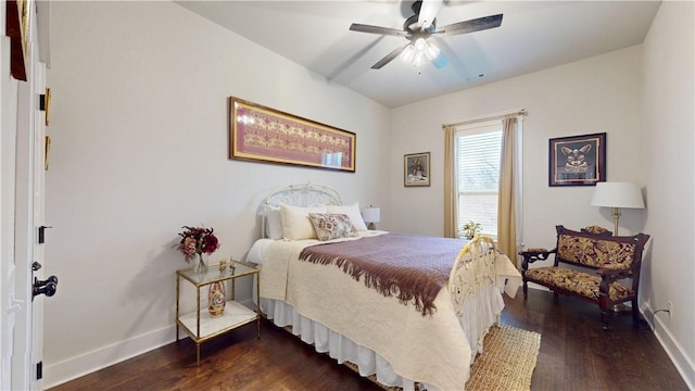 bedroom with a ceiling fan, baseboards, and dark wood-type flooring
