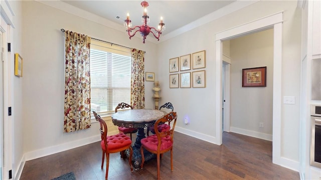 dining room with baseboards, a notable chandelier, and dark wood-style floors