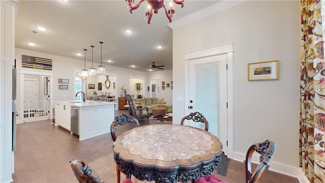 dining area featuring recessed lighting and ceiling fan with notable chandelier