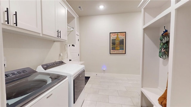 clothes washing area featuring light tile patterned flooring, baseboards, recessed lighting, cabinet space, and independent washer and dryer