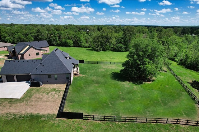 aerial view featuring a view of trees and a rural view