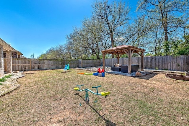 view of yard with a gazebo and a fenced backyard