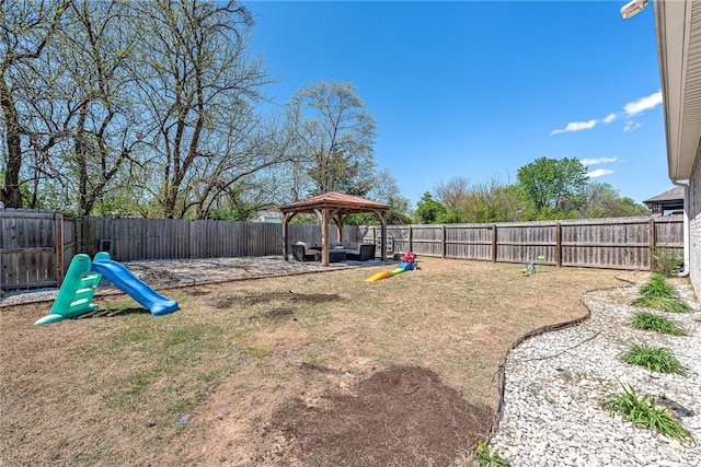 view of yard with a fenced backyard and a gazebo