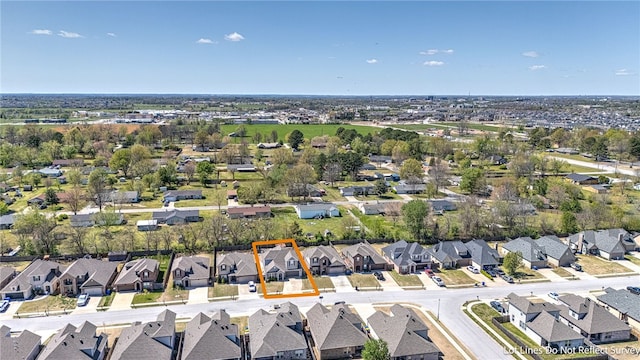 birds eye view of property with a residential view