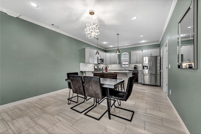 kitchen featuring a breakfast bar area, crown molding, visible vents, appliances with stainless steel finishes, and decorative backsplash