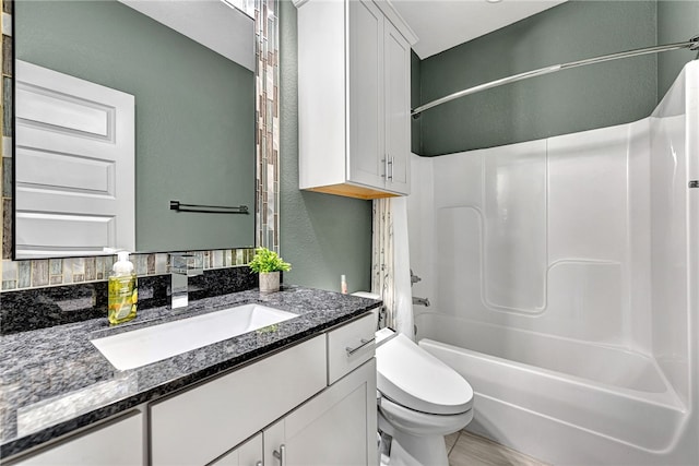 full bathroom featuring vanity, toilet, and shower / bathing tub combination