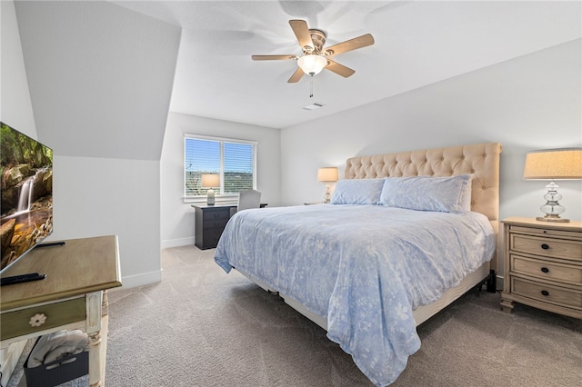 carpeted bedroom with visible vents, baseboards, and a ceiling fan
