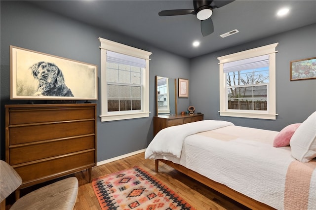 708 NW B St, Bentonville, AR 72712 - bedroom with visible vents, baseboards, recessed lighting, wood finished floors, and ceiling fan