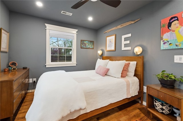 708 NW B St, Bentonville, AR 72712 - bedroom with wood finished floors, visible vents, baseboards, and ceiling fan