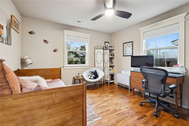 708 NW B St, Bentonville, AR 72712 - bedroom featuring light wood-type flooring, visible vents, and a ceiling fan