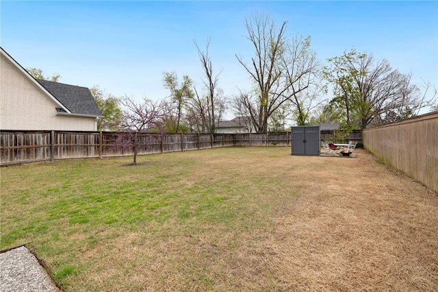 708 NW B St, Bentonville, AR 72712 - view of yard with a fenced backyard, an outdoor structure, and a storage shed