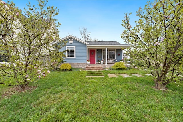 708 NW B St, Bentonville, AR 72712 - view of front of home featuring a porch and a front yard