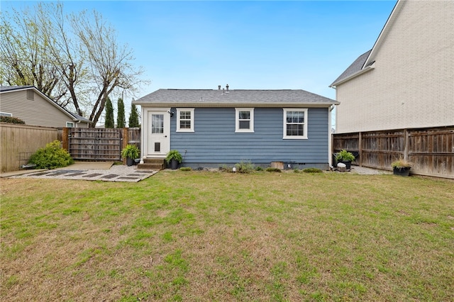 708 NW B St, Bentonville, AR 72712 - back of house featuring a lawn and a fenced backyard
