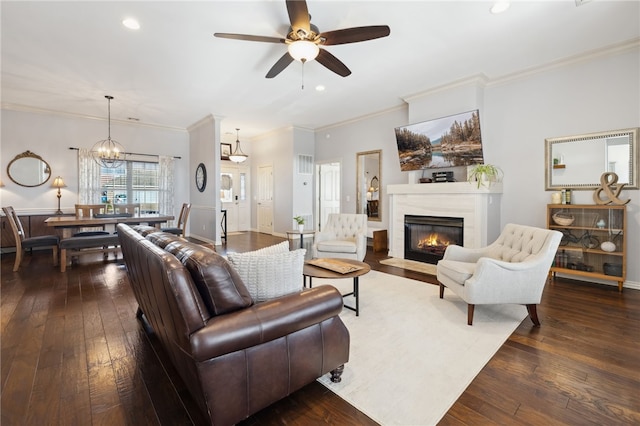 705 SW Maidstone Ave, Bentonville, AR 72712 - living area with ornamental molding, dark wood-style flooring, a fireplace with flush hearth, ceiling fan, and recessed lighting