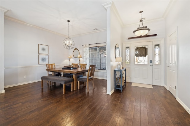 entrance foyer featuring baseboards, a notable chandelier, crown molding, and dark wood-type flooring