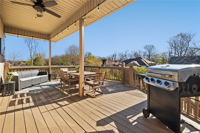 wooden deck with outdoor dining space, ceiling fan, outdoor lounge area, and a grill