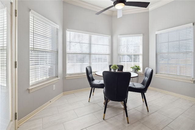dining space with ceiling fan, baseboards, and ornamental molding