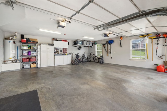 705 SW Maidstone Ave, Bentonville, AR 72712 - garage featuring gas water heater and a garage door opener