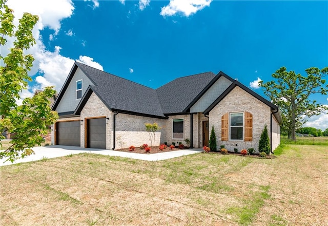 view of front of home featuring brick siding, a front lawn, concrete driveway, and roof with shingles