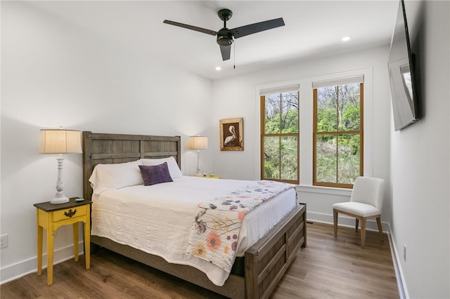 bedroom featuring recessed lighting, ceiling fan, baseboards, and wood finished floors