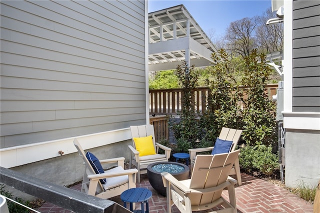 view of patio / terrace featuring a fire pit