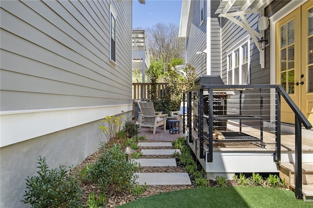 wooden deck featuring french doors