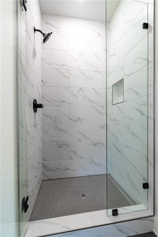 full bathroom featuring a stall shower