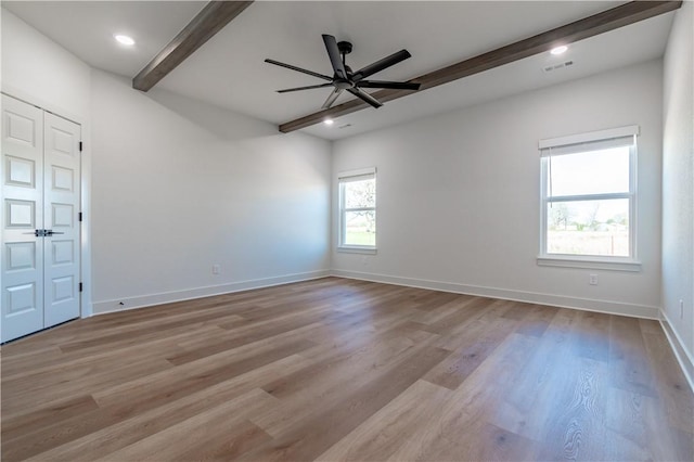 empty room featuring beamed ceiling, a ceiling fan, wood finished floors, baseboards, and recessed lighting