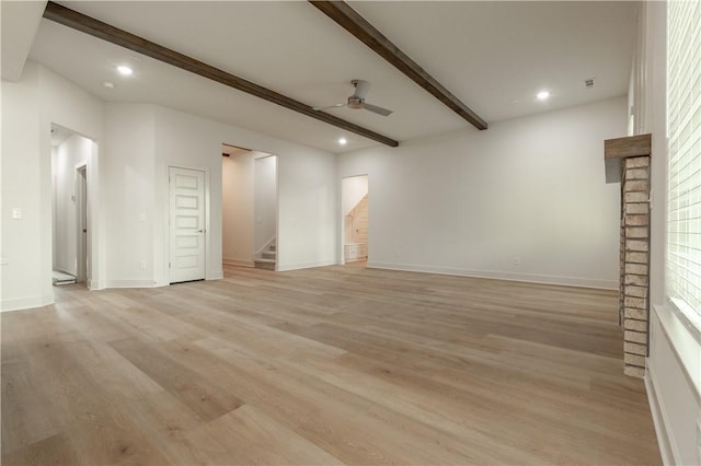 unfurnished room featuring a ceiling fan, beamed ceiling, stairs, light wood-style floors, and recessed lighting