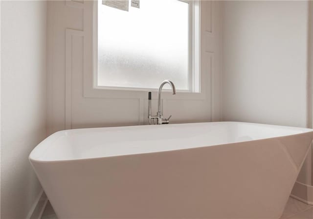 full bathroom featuring a soaking tub