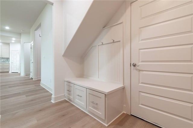 mudroom with light wood-type flooring, baseboards, and recessed lighting