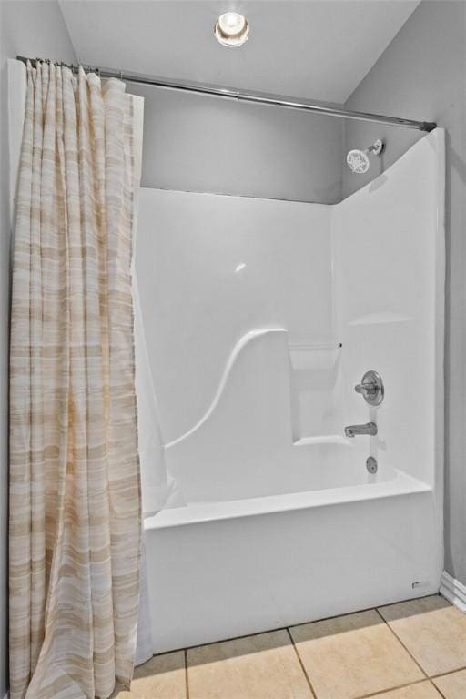 full bath with tile patterned floors and shower / bath combination with curtain
