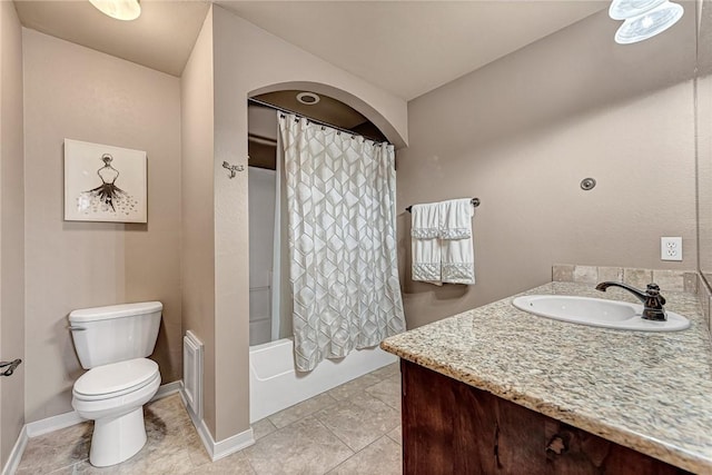 3207 SW Stonepoint Ave, Bentonville, AR 72712 - bathroom with toilet, vanity, baseboards, and shower / bath combo with shower curtain