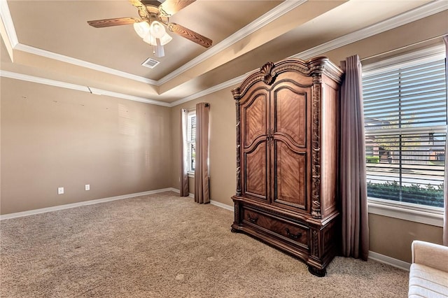 3207 SW Stonepoint Ave, Bentonville, AR 72712 - bedroom featuring baseboards, ornamental molding, visible vents, a tray ceiling, and light colored carpet